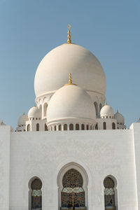 Low angle view of building against blue sky