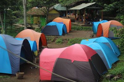 Row of multi colored tent on land