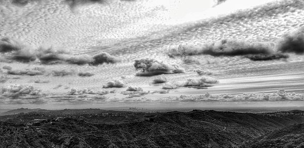 Scenic view of landscape against cloudy sky