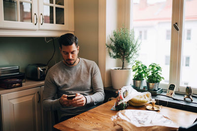 Man holding food at home