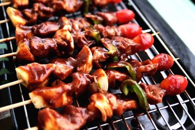 High angle view of meat on barbecue grill