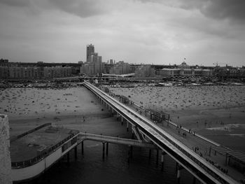 High angle view of people on pier at beach in scheveningen