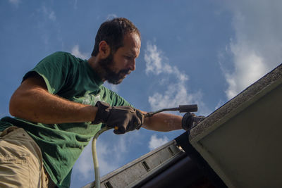 Side view of man working in workshop