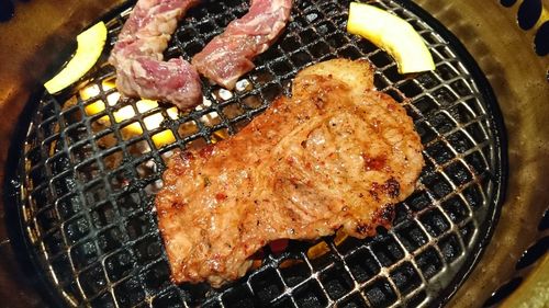 Close-up of meat on barbecue grill