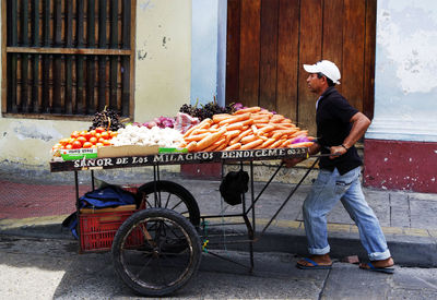 Man riding bicycle on street in city