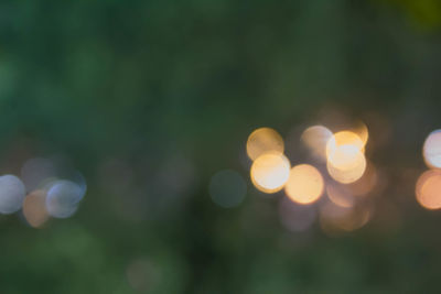 Defocused image of illuminated lights at night