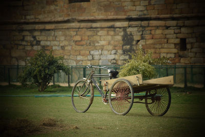 Bicycle parked against wall