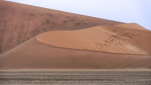 Scenic view of desert against clear sky