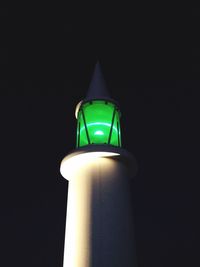 Low angle view of illuminated lamp post at night