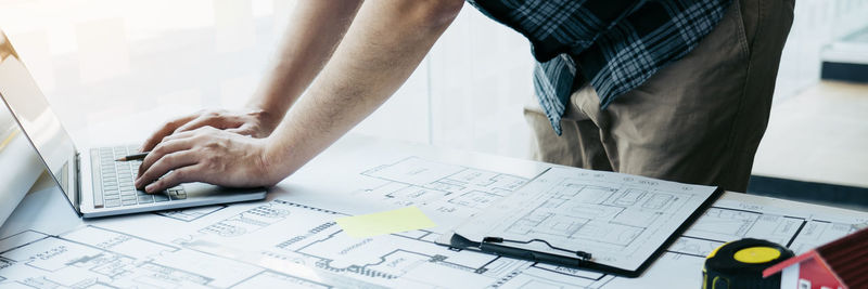 High angle view of people working on table