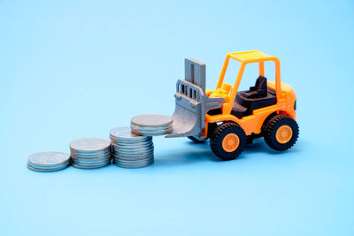 Close-up of toy car against blue background