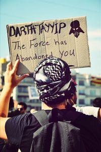 Close-up of woman holding camera