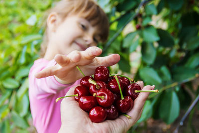 Close-up of girl holding fruit