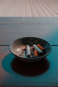 Close-up of cigarettes in ashtray