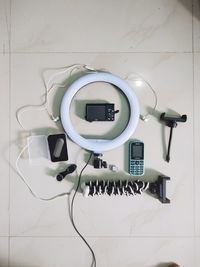 Directly above shot of laptop on table against white wall