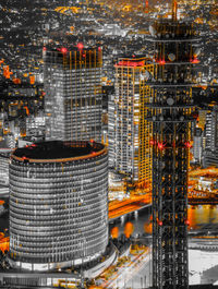 Aerial view of illuminated buildings in city