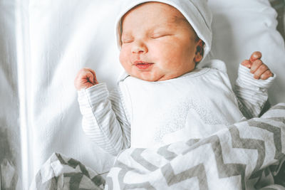 Boy sleeping on bed