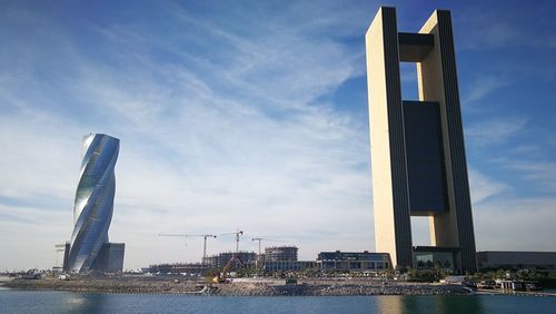 Modern building against cloudy sky