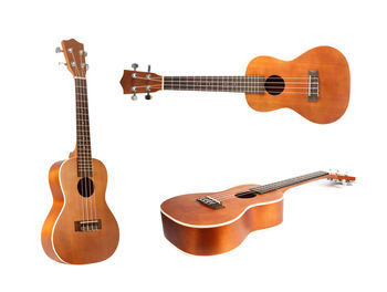 View of guitar against white background