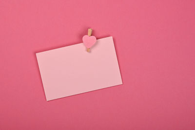 Close-up of heart shape on pink paper