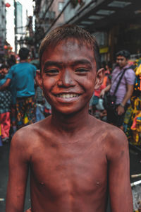 Portrait of smiling man standing outdoors