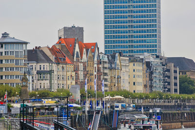 Panoramic view of buildings in city against sky