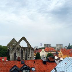 Houses in town against sky