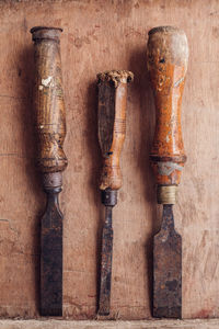 Directly above shot of rusty work tools on table