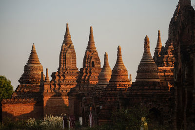 Panoramic view of old temple against building