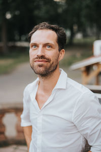 Portrait of young man standing outdoors