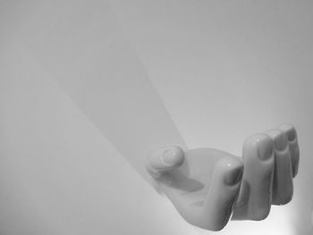 Close-up of woman against white background