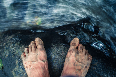 Low section of man on rock