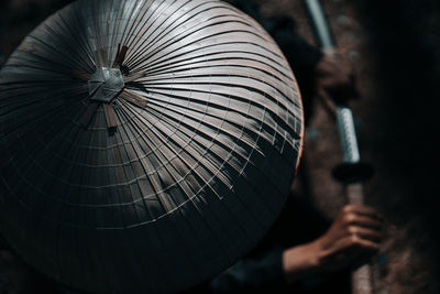 Close-up of man wearing bamboo hat