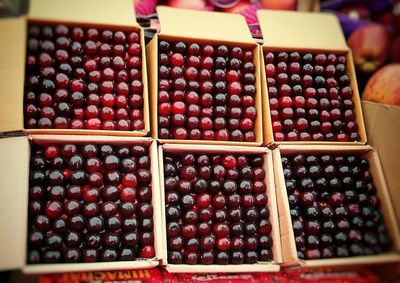 Close-up of fruits in crate at market stall