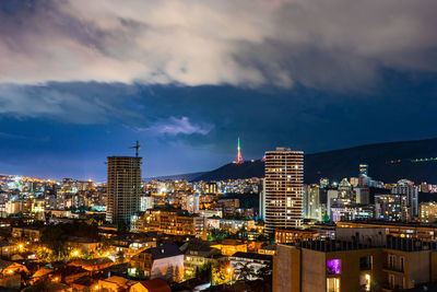 Illuminated buildings in city at night