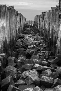 Rocks on beach against sky