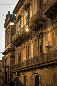 Low angle view of building against sky in city