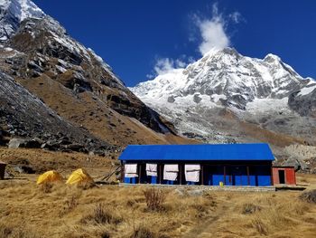 Built structure on mountain against clear blue sky