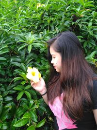 Girl with flowers and leaves