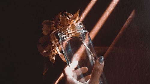 Close-up of hand holding glass