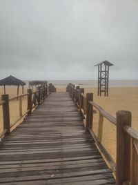 Pier over sea against sky