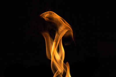 Close-up of fire against black background