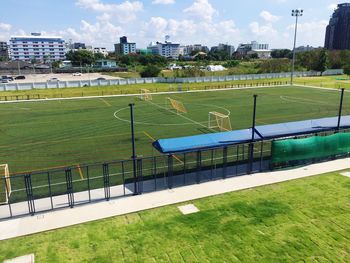 View of soccer field against cloudy sky