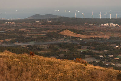 View of a field with mountain range in the background