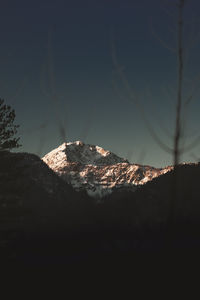 Scenic view of rock against sky at night