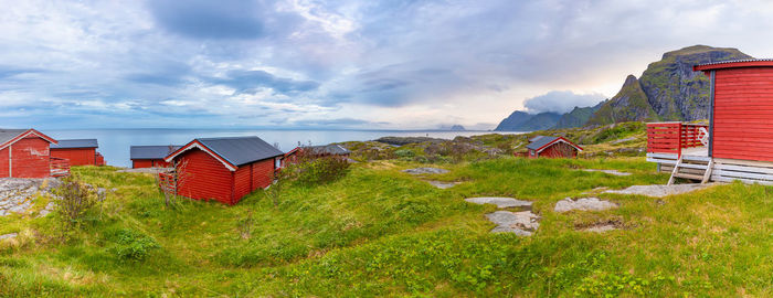 Houses on field against sky