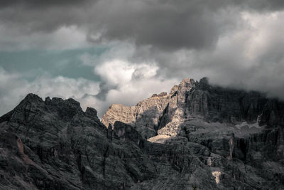 Scenic view of mountains against cloudy sky