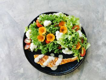 High angle view of fruits in plate on table