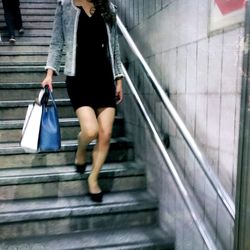 Woman standing on stairs