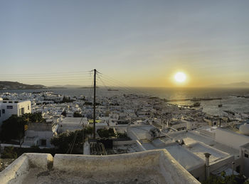 High angle view of cityscape against sky during sunset - mykonos, greece
